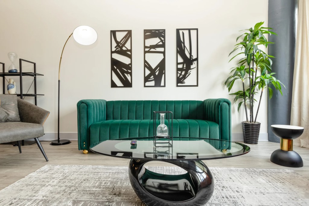 living room with green sofa