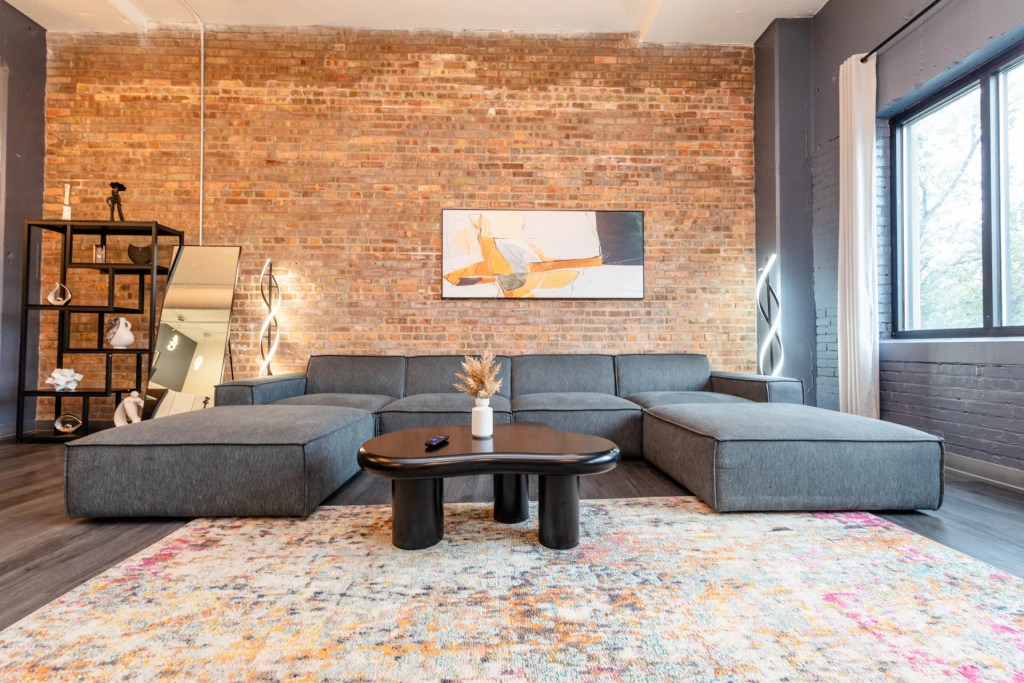 living room with large grey sofa