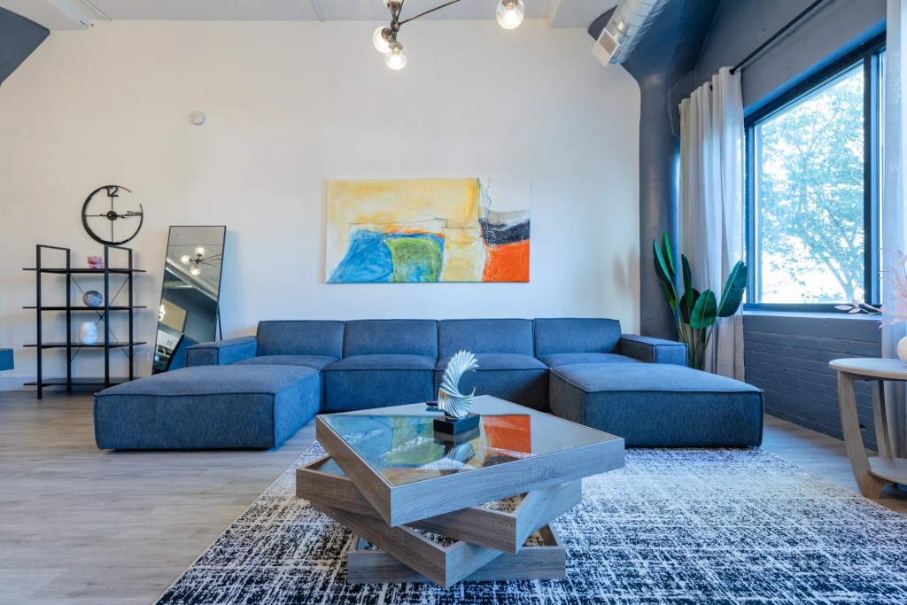 living room with colorful wall art