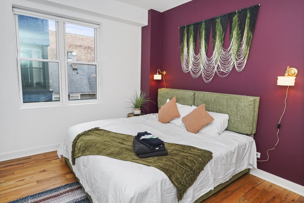 bedroom with green bed