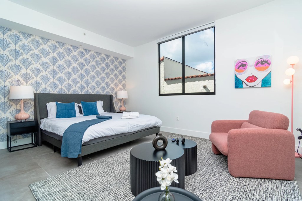 bedroom with pink chair