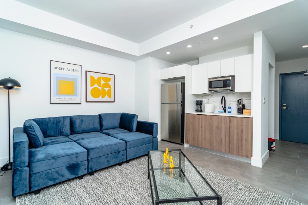 living room with blue sofa